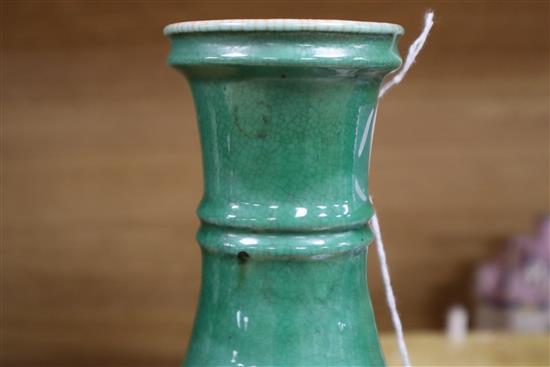 A Chinese sang de boeuf (langyao) vase and a Chinese green crackle glaze vase, 18th/19th century, Height 21cm